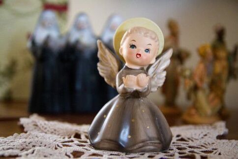 a statuette of an angel like an amulet of good luck