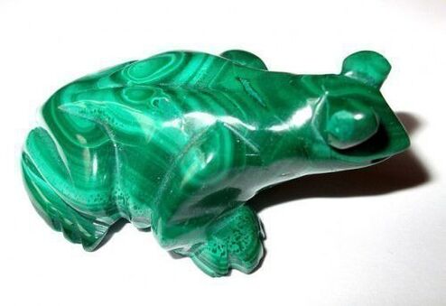 green malachite frog in the form of a successful amulet